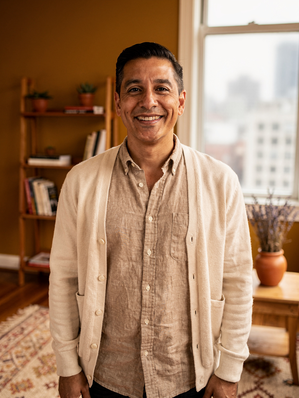 Alex Rivera, licensed therapist, in a calm, sunlit office